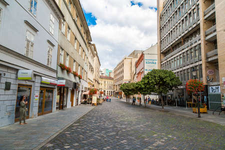 BRATISLAVA, SLOVAKIA - SEPTEMBER 17, 2016 : Historical streets of Bratislava with small tiny houses on cloudy sky background.のeditorial素材