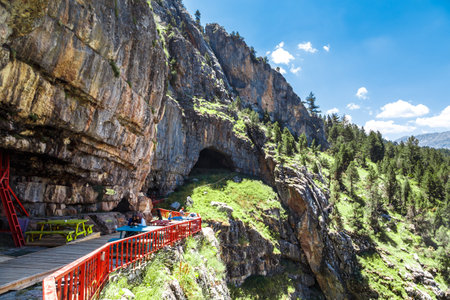 KONYA, TURKEY - JUNE 27, 2017 : Landscape view of entrance of Tinaztepe Caves in Konya, formed with stalagmites and stalactites around with the lenght of 1518 m area to visit.のeditorial素材