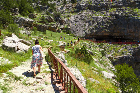 KONYA, TURKEY - JUNE 27, 2017 : Landscape view of entrance of Tinaztepe Caves in Konya, formed with stalagmites and stalactites around with the lenght of 1518 m area to visit.のeditorial素材