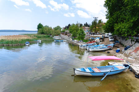 BURSA, TURKEY - APRIL 21, 2018 : Beautiful Uluabat lake view with boats and trees in Golyazi (Apolyont) in Bursa city of Turkey.のeditorial素材