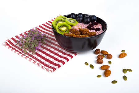 Healthy lifestyle, mix of energy fruits and dried nuts in cup, breakfast or morning snack concept, isolated on white background.の写真素材