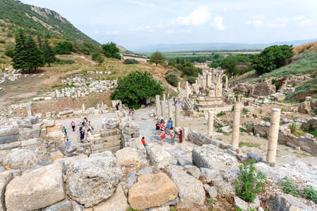 EPHESUS, TURKEY - JUNE 20, 2018 : Ruins in historical ancient city Ephesus with people around on cloudy sky in Izmir, Turkey.のeditorial素材