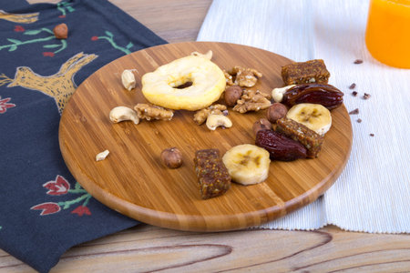Top view of healthy food and energetic lifestyle concept with mixed nuts and fruits.