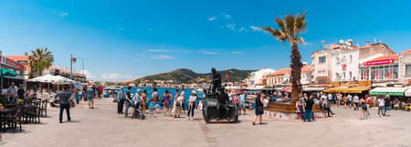 IZMIR,  TURKEY - JUNE 05, 2019 : Fishing boats in touristic place of Aegean Region in Phocaea Town with old and historical, traditional architecture buildings. Phocaea is ancient city in old dates.のeditorial素材