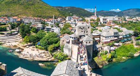 MOSTAR, BOSNIA - AUGUST 4, 2019 : Panoramic view of Old Mostar Bridge on Neretva River from observation tower. Mostar is one of the most famous place of Balkans.のeditorial素材