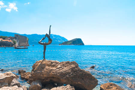 Old Town of Budva and dancing woman sculpture.の写真素材