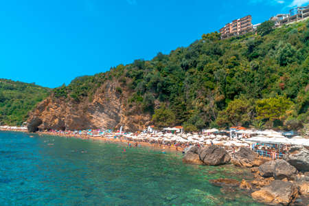 BUDVA, MONTENEGRO - AUGUST 5, 2019 : Panoramic view of Mogren Beach in Budva. Most popular beach on Budva Riviera.のeditorial素材