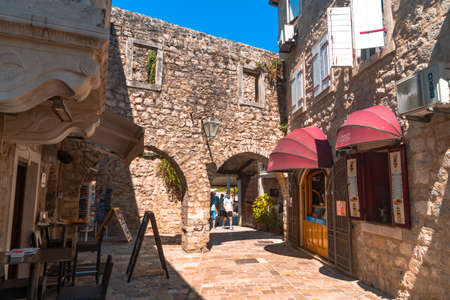 BUDVA, MONTENEGRO - AUGUST 5, 2019 : Historical buildings in citadel old town. Budva has oldest settlements citadel ancient walls near Balkan mountains and Adriatic Sea.のeditorial素材