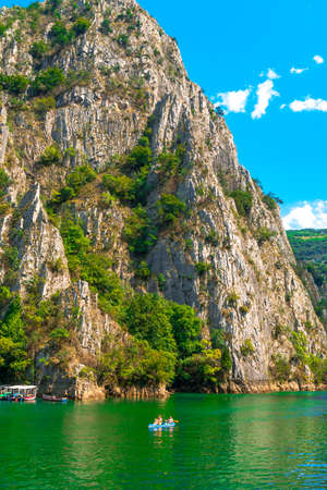 SKOPJE, MACEDONIA - AUGUST 8, 2019 : View of Matka Canyon. Mat is most beautiful touristic attraction near Skopje, people kayaking on landscape.のeditorial素材