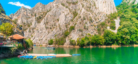 SKOPJE, MACEDONIA - AUGUST 8, 2019 : View of Matka Canyon. Mat is most beautiful touristic attraction near Skopje, people kayaking on landscape.のeditorial素材