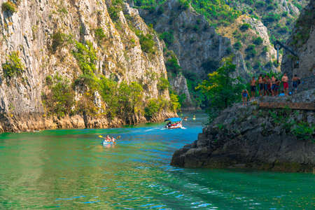 SKOPJE, MACEDONIA - AUGUST 8, 2019 : View of Matka Canyon. Mat is most beautiful touristic attraction near Skopje, people kayaking on landscape.のeditorial素材