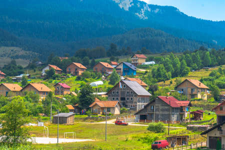 Mountain houses in plateau belong mountains.の写真素材