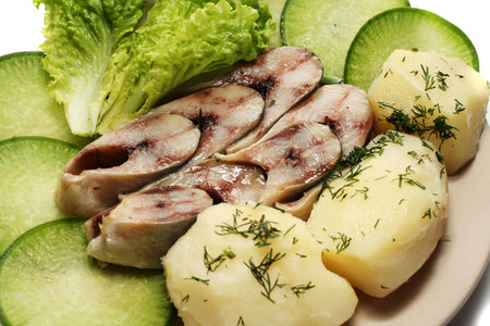Herring on a platter. Close-up. Isolated on a white background.の写真素材