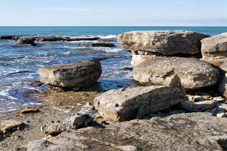 Rocky shore of the Caspian Sea. Winter season.の写真素材