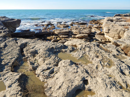Rocky shore of the Caspian Sea. Winter season.の写真素材