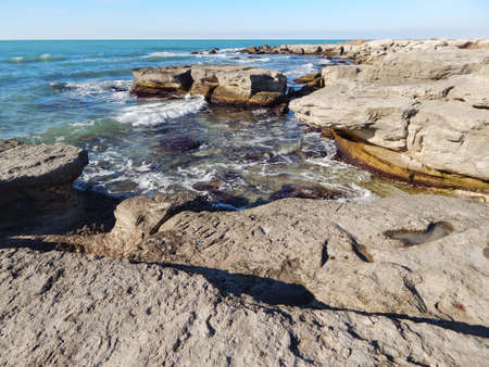 Rocky shore of the Caspian Sea. Winter season.の写真素材