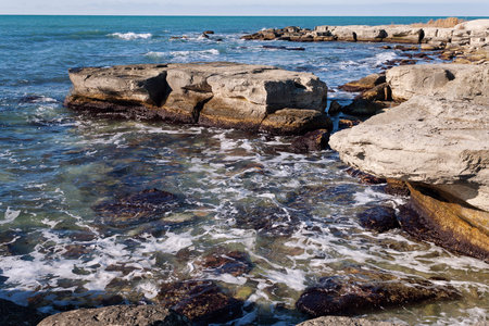 Rocky shore of the Caspian Sea. Winter season.の写真素材