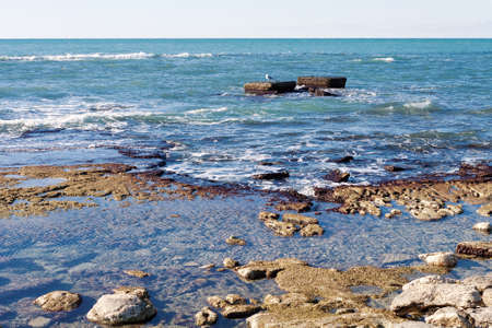 Rocky shore of the Caspian Sea. Winter season.の写真素材