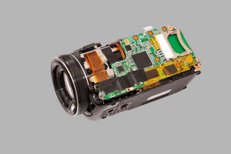 Disassembled compact camcorder. Close-up. Isolated on a gray background.の写真素材