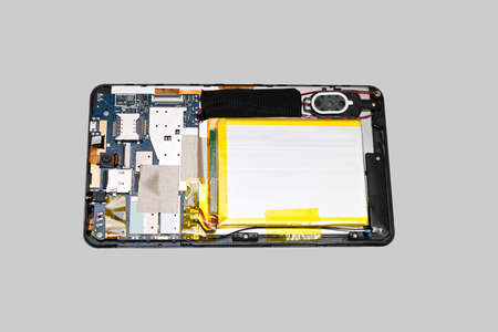 Disassembled tablet computer. Isolated on gray background.の写真素材