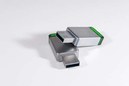 USB flash drives in a metal case. On a white background.の写真素材