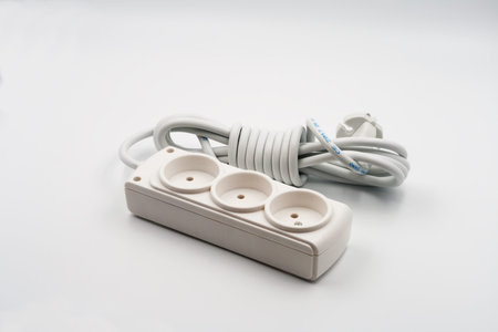 Extension cord electric household. Close-up. On white background.