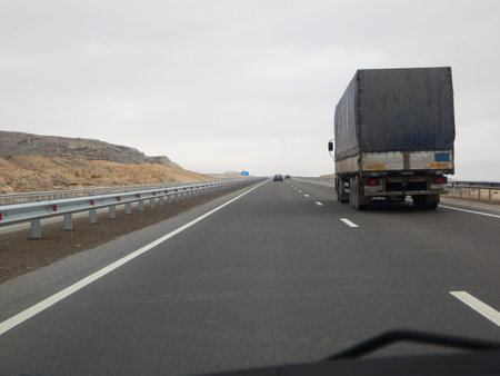 Traffic on the motorway. Cavity Karagiye. Mangistau region. Kazakhstan.の写真素材