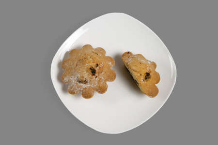 Cupcake on a white plate. Isolated on gray background.の写真素材
