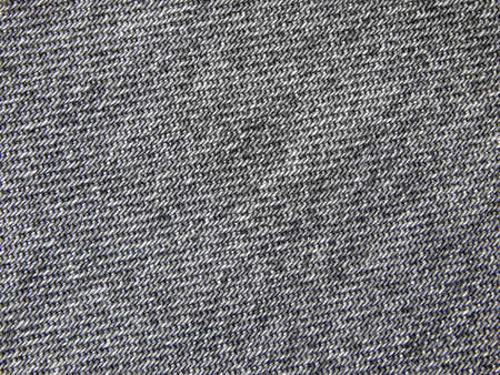 Texture of a gray old jeans fabric.の写真素材