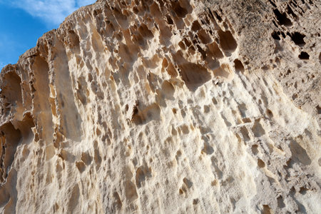 Surface sandy rock. Rocky shore of the Caspian Sea.