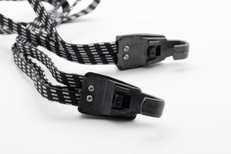 Luggage elastic bands with hooks. Close-up. On white background.の写真素材