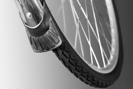 Front bicycle wheel. Close-up. Isolated on white background.の写真素材