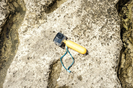 Compact underwater photo and video camera. Rocky shore of the Caspian Sea.の写真素材