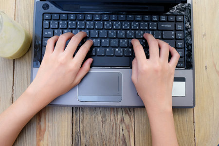 working time with laptop on wooden table