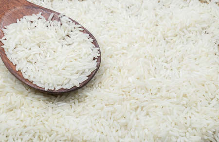 white rice in a wooden spoon. view from topの写真素材