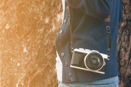Woman photographer in the park. vintage toneの写真素材
