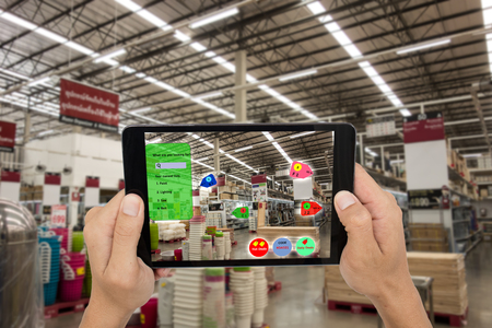 internet of things marketing concepts,smart augmented reality,customer hold the taplet to see the product that search by ai application with hot deal,promotion codeの写真素材