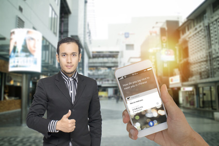 iot, internet of things, translation technology concept, foreigner use smart phone translate meaning nice to meet you in English to Chinese language by voice commandの写真素材