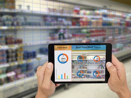 iot, internet of things,smart retail concepts,A storeâs manager can check what data of real time insights into shelf status from artificial intelligence(ai) on smart shelf to reports on a tablet.の写真素材