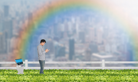smart farming concept, Agronomist or Farmer work in the urban or vertical farm with robot (artificial intelligence) and check,management, monitor keep data analysis in each day in the agriculture farmの写真素材