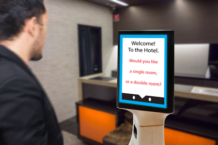 robot in hotel concept, robotic butler help the customer to booking the room, put the object, food, accessories inside it.の写真素材