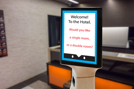Robot in hotel concept. Electronic system to help customer to book a room.の写真素材