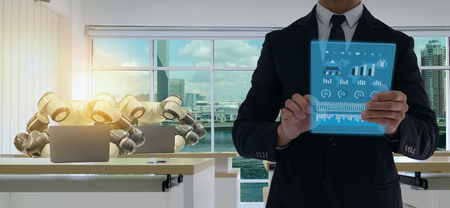 iot smart factory in industry 4.0 robot technology concept, engineer , business man using futuristic tablet to control ,monitor, management robotic to improve efficiency, product, quality, reduce costの写真素材