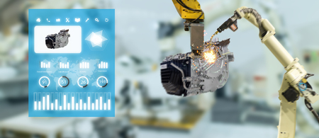 iot industry 4.0 concept,industrial engineer using smart glasses with augmented mixed with virtual reality technology to monitoring machine in real time.Smart factory use Automation robot armの写真素材