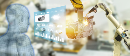 iot industry 4.0 concept,industrial engineer using smart glasses with augmented mixed with virtual reality technology to monitoring machine in real time.Smart factory use Automation robot armの写真素材