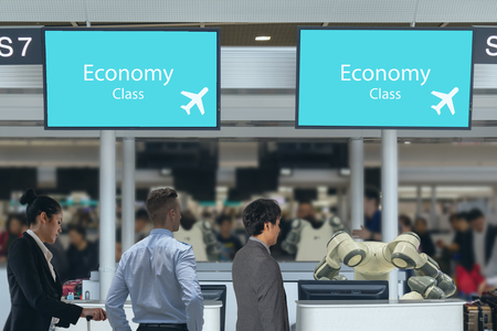 smart hotel in hospitality industry 4.0  concept, the receptionist robot (robot assistant ) in counter check in airports always welcome passenger the service is  booking,boarding information provisionの写真素材