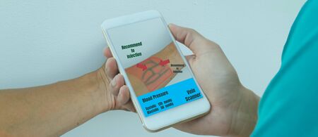 smart medical technology concept . the technology use with artificial intelligence with augmented mixed virtual reality with find blood line in vein for injection the drug in to the blood  with robotの写真素材