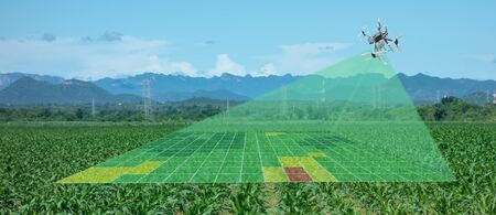 drone for agriculture, drone use for various fields like research analysis, safety,rescue, terrain scanning technology, monitoring soil hydration ,yield problem and send data to smart farmer on tabletの写真素材