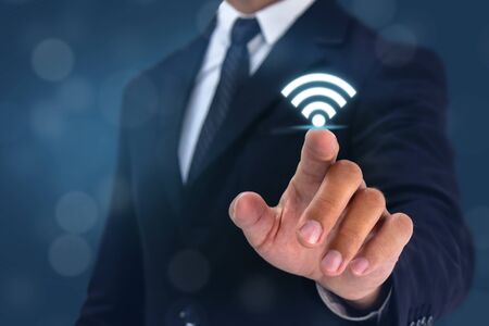 business man point hand to wifi 5g sign onの写真素材