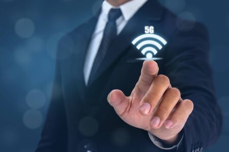 business man point hand to wifi 5g sign onの写真素材